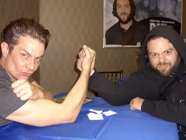 Actors James Marsters and Dan Fogler clowing around in the autograph signing area during the Big Apple Convention in Manhattan, May 21, 2011. Photographed by Lu