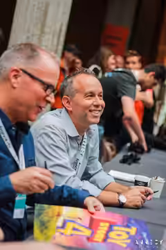 Mark Nielsen and Jonas Rivera at a signing session for "Toy Story 4" at the 2019 Annecy International Animation Festival.
