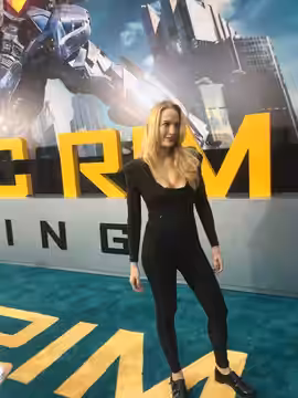 Emily Carmichael appears on the red carpet at the premiere of Pacific Rim: Uprising (2018)