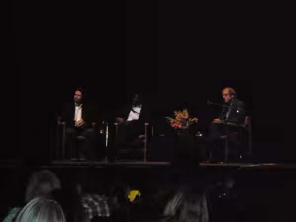 Author Dave Eggers, Valentino Achak Deng, the subject of Eggers' novel What is the What, and KQED-FM talk show host Michael Krasny at a discussion of What is th (2008)