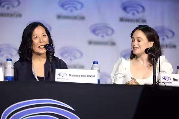 Melinda Hsu Taylor and Noga Landau speaking at the 2022 WonderCon, for "TV Guide Magazine’s 2022 Fan Favorites: Warner Bros. Television Showrunners Edition", at