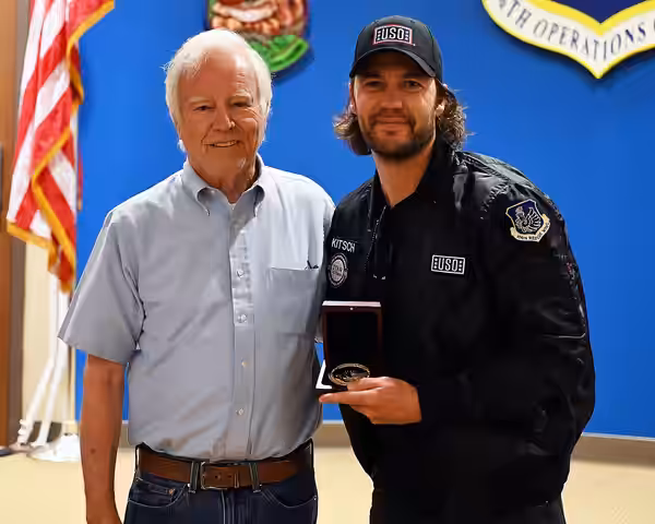 Taylor Kitsch (right) and Dan Murphy (left) take a photo after Murphy presented Kitsch with the Bob Hope Award for Excellence in Entertainment from the Congress (2025)