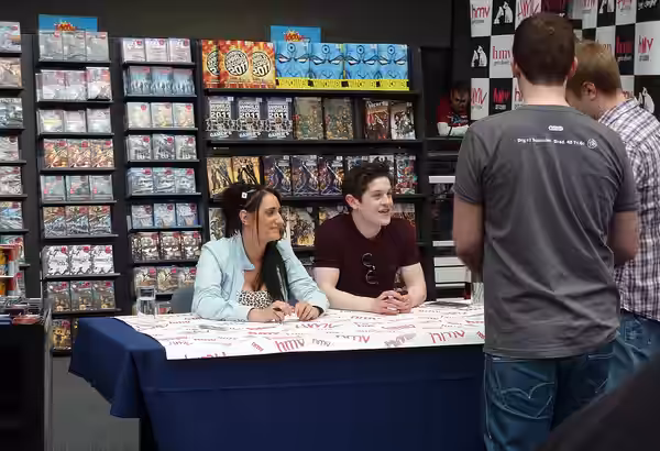 Lauren Socha and Iwan Rheon of Misfits doing a signing (2011)
