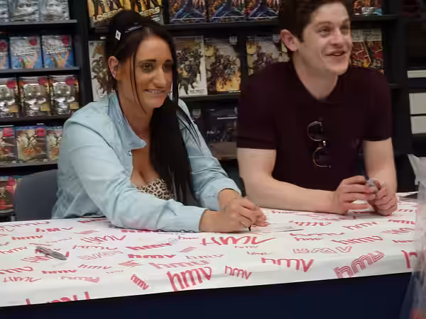 Lauren Socha and Iwan Rheon of Misfits doing a signing (2011)