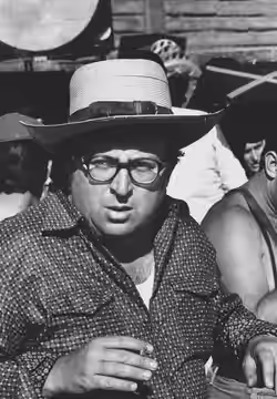 Sergio Leone on the set of A Genius, Two Partners and a Dupe (1975)