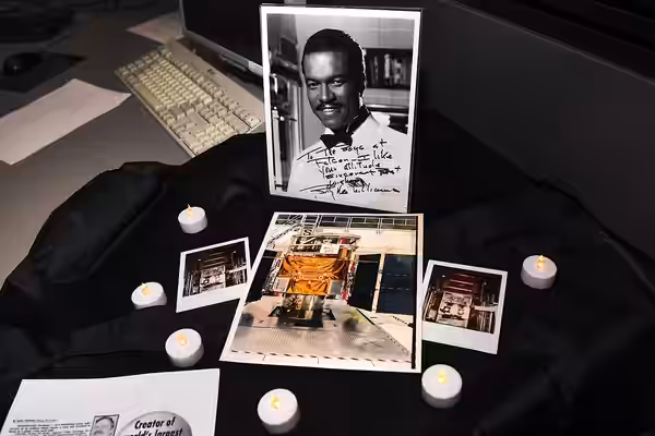 A picture of actor and singer Billy Dee Williams, along with pictures of a satellite named after him, were displayed at the 2nd Space Operations Squadron floor 
