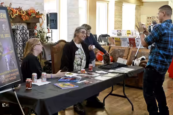 Peter Mayhew, who played the character Chewbacca in "Star Wars," poses for a picture as he signs autographs during an event at the Warrior and Family Support Ce