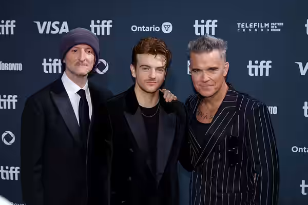 Michael Gracey, Jonno Davies, and Robbie Williams at the 2024 Toronto International Film Festival (TIFF) for the movie Better Man.