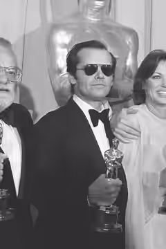 Saul Zaentz, Jack Nicholson, Louise Fletcher and Michael Douglas posing with their Oscars at the 1976 Academy Awards on March 30, 1976