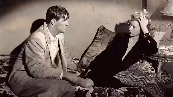 Macao (film) 1952. Josef von Sternberg, Nicholas Ray, directors - L to R Robert Mitchum, Gloria Grahame RKO Pictures