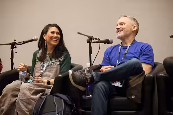 Colleen O'Shaughnessey and Roger Craig Smith speaking with attendees at the 2024 Game On Expo at the Phoenix Convention Center in Phoenix, Arizona. Please attri