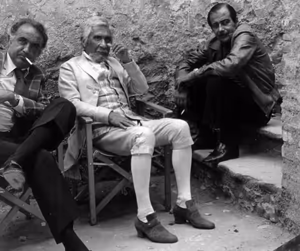 Lazio (Italy), 1975. From left to right: producer Arturo La Pegna, actor Paolo Stoppa and director Daniele D'Anza in a break during the shooting of the televisi