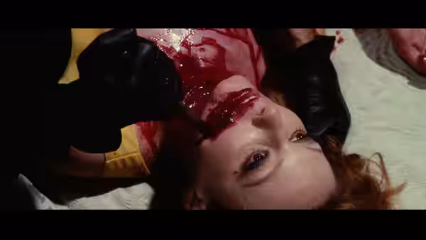 Black-gloved killer murdering a victim in Death Walks on High Heels (1971)