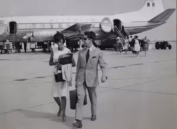 Alitalia Douglas DC-6 and Franco Cristaldi with his secretary Paola Quagliero, a roman born ca 1940.[1] So, this is estimated to be in 1960.