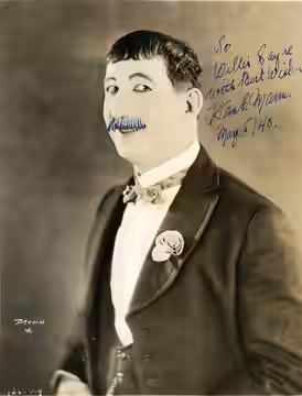 Hank Mann, film comedian. From the back: "'Hank Mann, in 'Desire' To bear the name of E.Z. Pickins with a smile is an almost heroic task - yet Hank Mann, appear (1925)