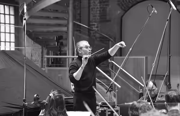 Airat Ichmouratov conducts the London Symphony Orchestra during the recording session of his Piano Concerto on 19th April 2022, St Luke's, London, UK