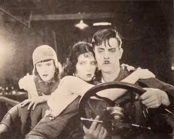 Still from the American film A Connecticut Yankee in King Arthur's Court (1921) with Rosemary Theby, Pauline Starke, and Harry Myers, on page 84 of the March 5,