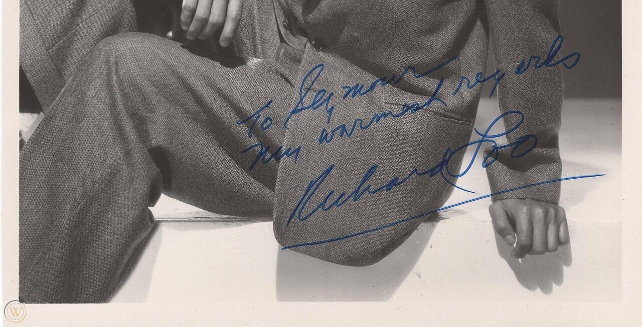 Close-up of the autograph on a portrait of Richard Loo