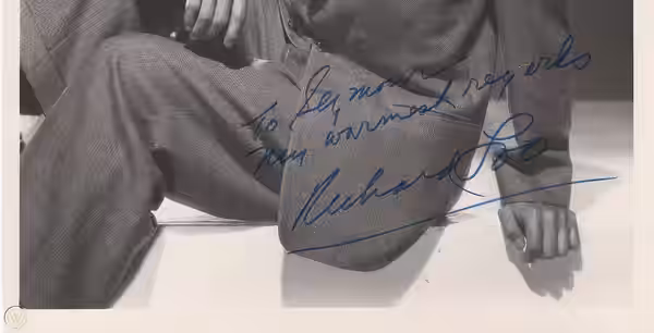 Close-up of the autograph on a portrait of Richard Loo