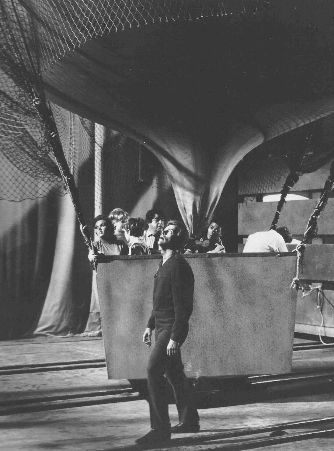 Photo of the cast of the science fiction television program Land of the Giants. The earthlings try to escape in a gondola attached to a toy balloon. (1968)