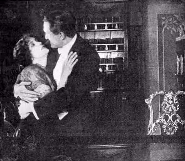 Still from the 1915 British film As Ye Repent, retitled Redeemed for distribution in the United StatesLeft to right: Florence Turner, Tom Powers (1916)