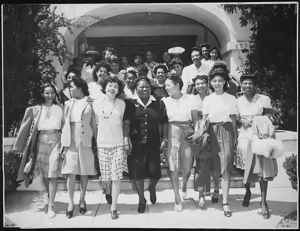 Hattie McDaniel leading entertainers from her Los Angeles home to Minter Field for a performance for World War II soldiers in 1942. McDaniel (center), in front 