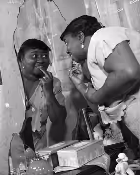 Actress Hattie McDaniel at her dressing table mirror (1940)