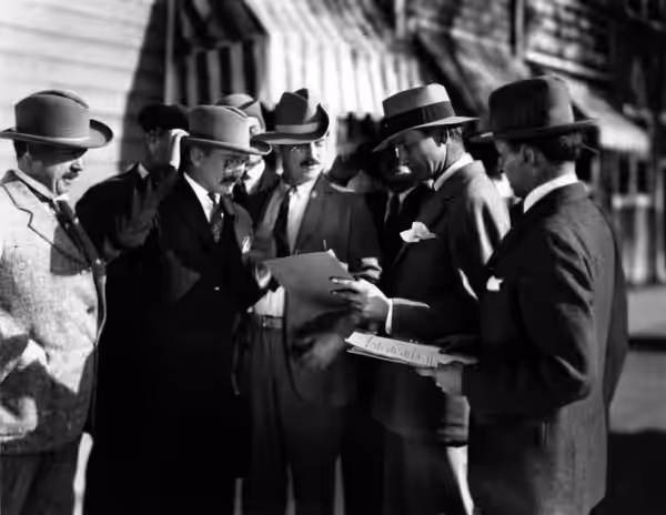 Director Victor Fleming, Roosevelt biographer Hermann Hagedorn, and potential Theodore Roosevelt doubles on the set of The Rough Riders. Text from back of photo (1926)