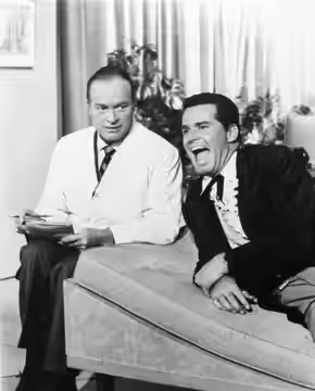 Photo of Bob Hope and James Garner rehearsing a skit for the television special The Bob Hope Buick Show.