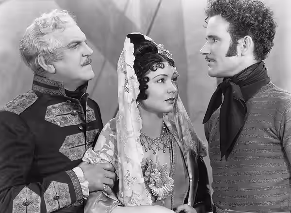 L. to R. : Frank Morgan, Steffi Duna, and Charles Collins in Dancing Pirate - cropped screenshot (1936)