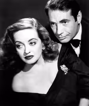Publicity still of Bette Davis (as Margo Channing) and Gary Merrill (as Bill Sampson) in the 1950 film All About Eve. Such images were taken by a studio photogr