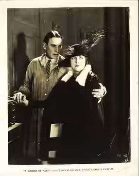Lobby card for the American film A Woman of Paris (1923) with Carl Miller and Edna Purviance.