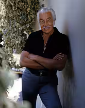 Cesar Romero taken outside his home in Beverly Hills, California