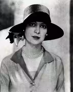 Actress Ilka Chase in a fashion shot, on page 23 of the May 1926 The New Eve magazine. Caption: "Wide of brim and high of crown," says Paris, for the new hats. 