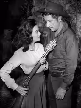 Photo of Richard Boone as Paladin and guest star Patricia Medina from the television program Have Gun, Will Travel. (1960)
