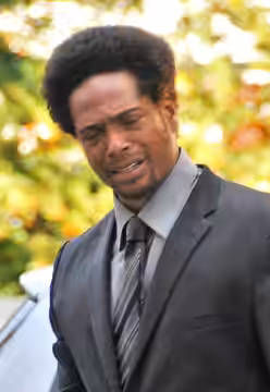 Gary Dourdan, film and television actor in Berlin, Germany. (This version has been cropped and brightness adjusted to account for main subject being in shadow.  (2008)