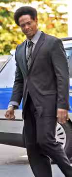 Gary Dourdan, film and television actor in Berlin, Germany. (This version has been cropped and brightness adjusted to account for main subject being in shadow.  (2008)