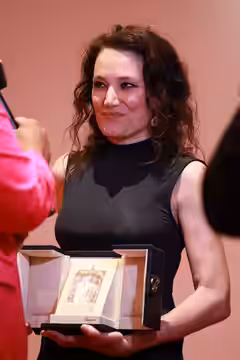 Coralie Fargeat at the 2024 Cannes Film Festival closing press conference for her film The Substance.