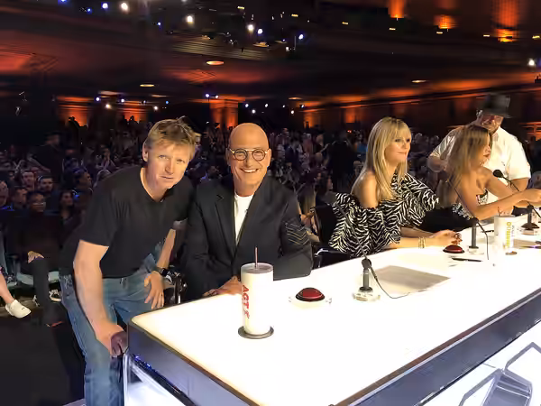 Comedian Howie Mandel and technology executive Trevor Doerksen pose on set of America's Talent days before COVID-19 shut down TV production across Los Angeles,  (2020)