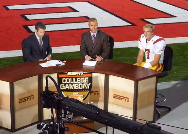 ESPN College GameDay's Chris Fowler (left) and Kirk Herbstreit (center) doing post-game interview with the USC Trojans' Matt Barkley (right) in Ohio Stadium in 