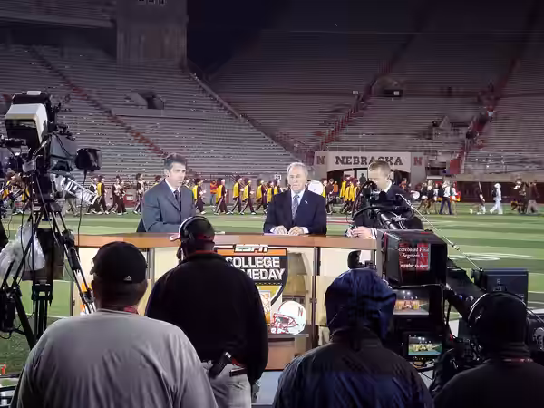 The crew of ESPN College GameDay, from left to right Chris Fowler, Lee Corso and Kirk Herbstreit records their wrap-up of the day's games for SportsCenter, this (2007)