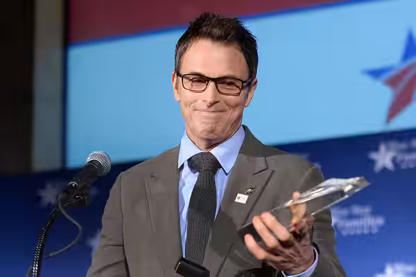 Screen, stage and voice actor Tim Daly holds an award presented to The Creative Coalition during the Blue Star Families 5th Anniversary Celebration in Washingto (2015)