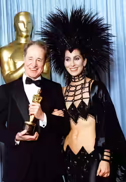 Don Ameche and Cher at the 1986 Academy Awards. Cher's dress was designed by Bob Mackie.