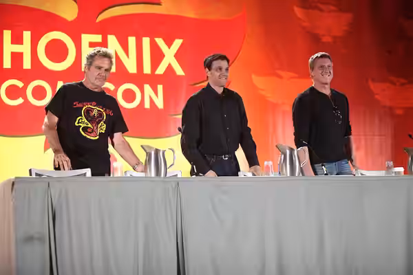 Martin Kove, Ralph Macchio and William Zabka speaking at the 2016 Phoenix Comicon at the Phoenix Convention Center in Phoenix, Arizona. Please attribute to Gage