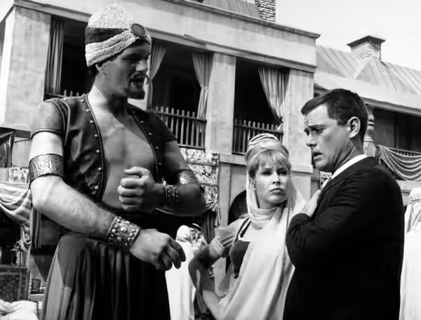 Photo of Richard Kiel as Ali with Barbara Eden and Larry Hagman as Jeannie and Tony in the "My Hero?" episode of I Dream of Jeannie.