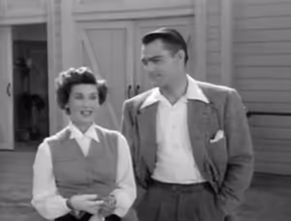 John Russell and Lucille Barkley in The Fat Man - cropped screenshot (1951)