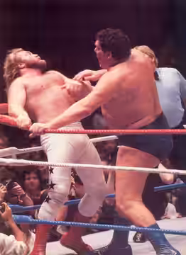 Andre the Giant (right) chops John Studd (left) at Wrestlemania I (1985)