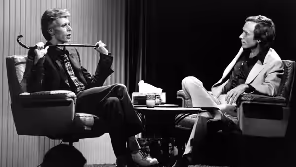 Rock music superstar David Bowie sits with Dick Cavett for his first talk show apperance in America on The Dick Cavett Show, a Wide-World special to be seen on  (1974)