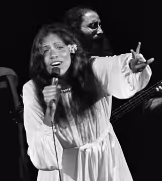 James Taylor and Carly Simon performing onstage in Los Angeles (1975)