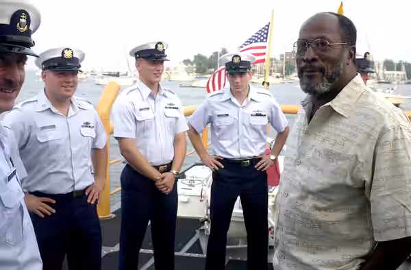 Annapolis, MD (Aug. 8)--John Amos takes a moment to chat with crewmembers of the U.S. Coast Guard Cutter Cochito before the Coast Guard Band concert. Amos is gu (2001)